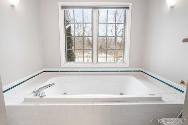 bathroom featuring a tub with jets