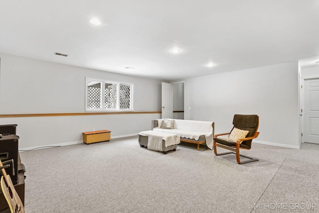 sitting room with carpet floors, recessed lighting, visible vents, and baseboards