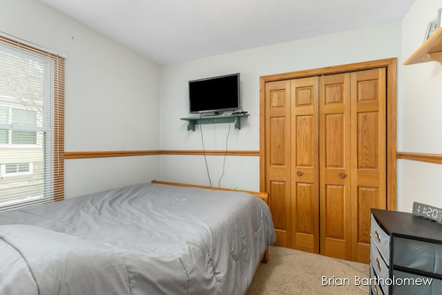 bedroom with light colored carpet