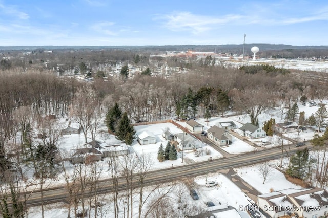 snowy aerial view with a residential view