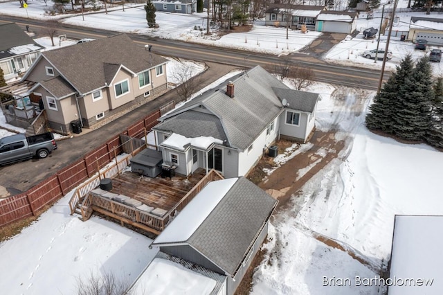 snowy aerial view with a residential view