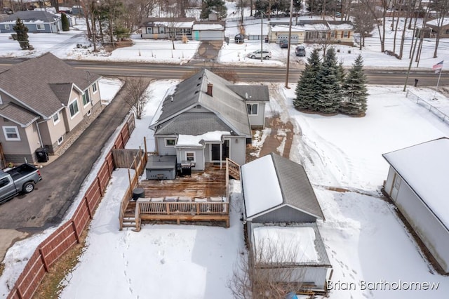 snowy aerial view featuring a residential view