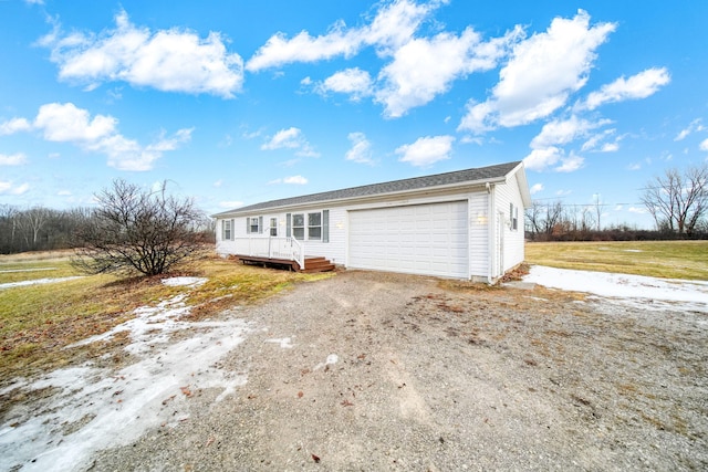 view of front of home with a garage and driveway