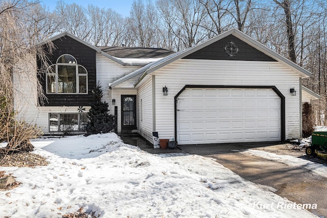 view of front facade featuring driveway and an attached garage