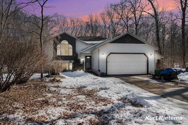 view of front of house with driveway and an attached garage