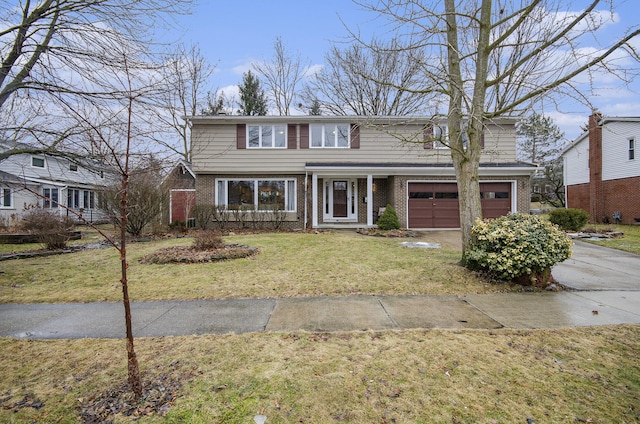 traditional home featuring a garage, concrete driveway, brick siding, and a front lawn