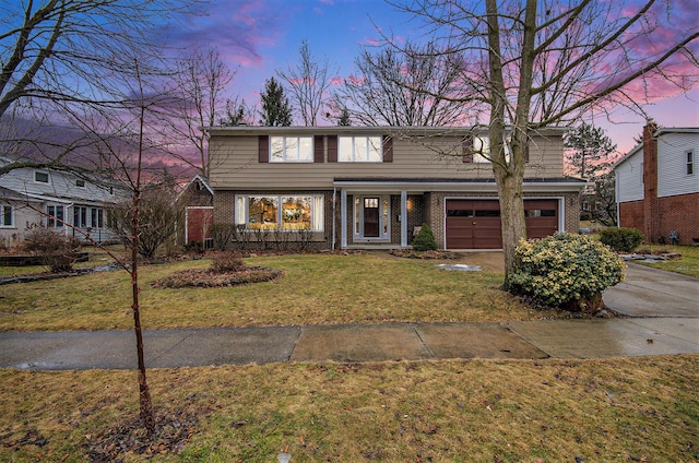 traditional home with concrete driveway, brick siding, and a lawn