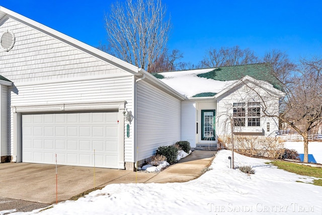 single story home with a garage and driveway