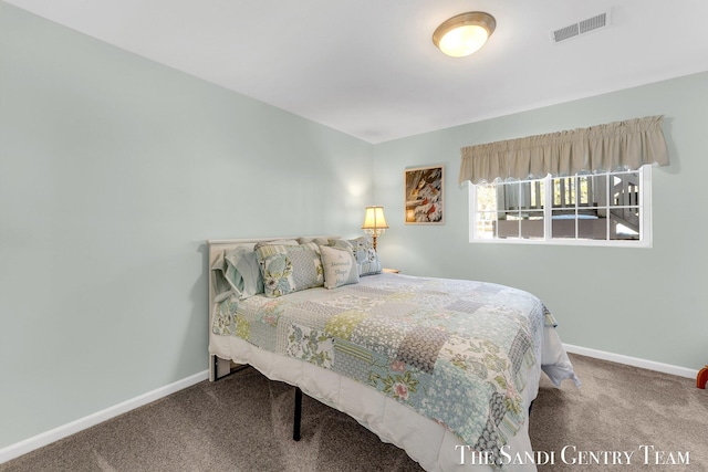 bedroom featuring carpet floors, visible vents, and baseboards