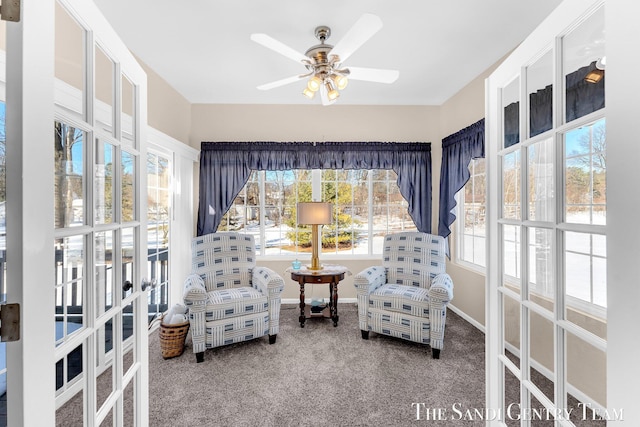 sitting room with carpet, baseboards, ceiling fan, and french doors