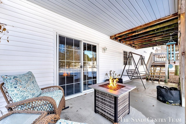 view of patio with a fire pit