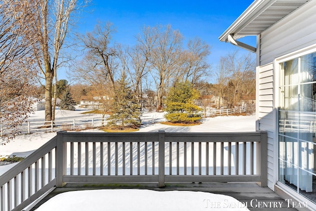 view of snow covered deck