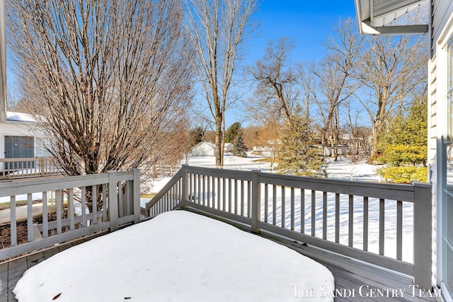 view of snow covered deck