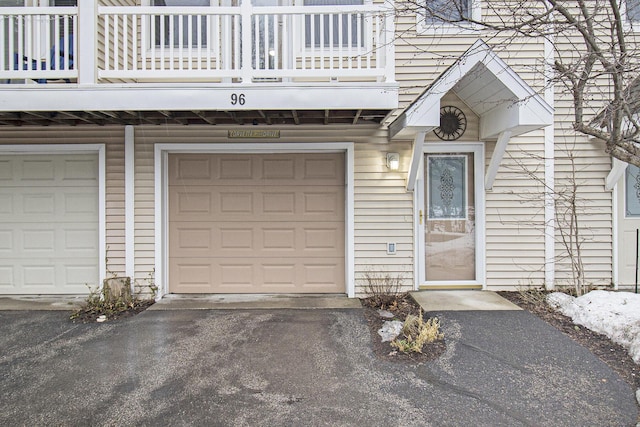 garage with aphalt driveway