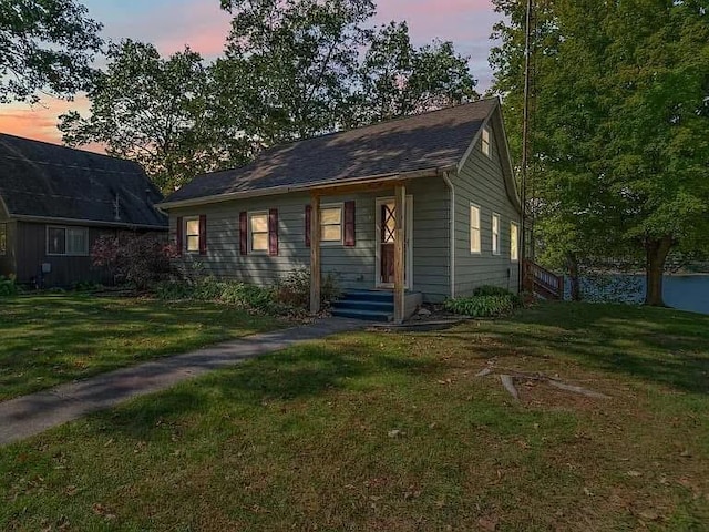 view of front of property with a yard