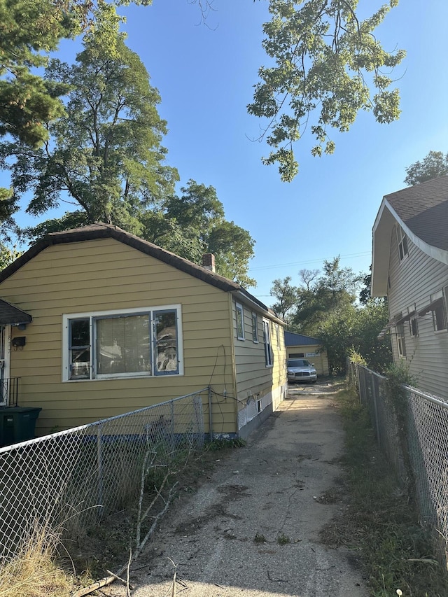 view of side of property with fence