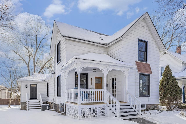 view of front of house featuring a porch and central AC unit