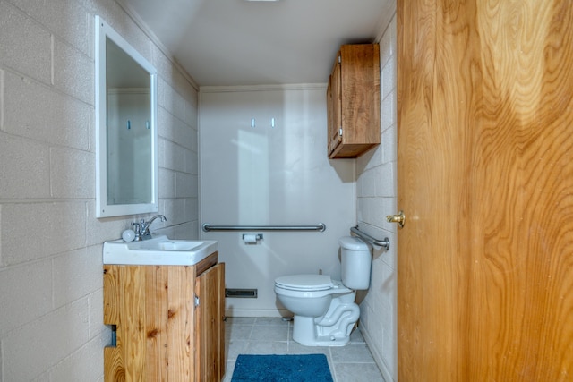 half bath featuring toilet, tile patterned flooring, and vanity