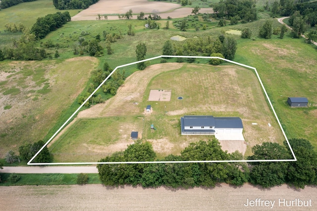 birds eye view of property with a rural view