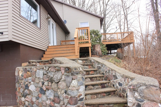 exterior space featuring stairway and a wooden deck