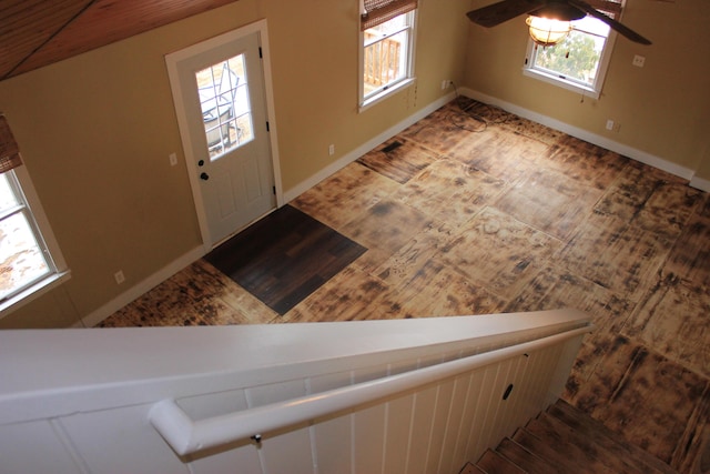 foyer featuring baseboards