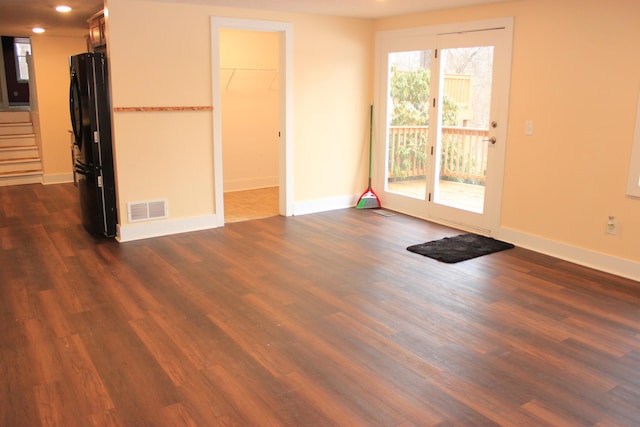 interior space with baseboards, visible vents, dark wood finished floors, stairway, and recessed lighting