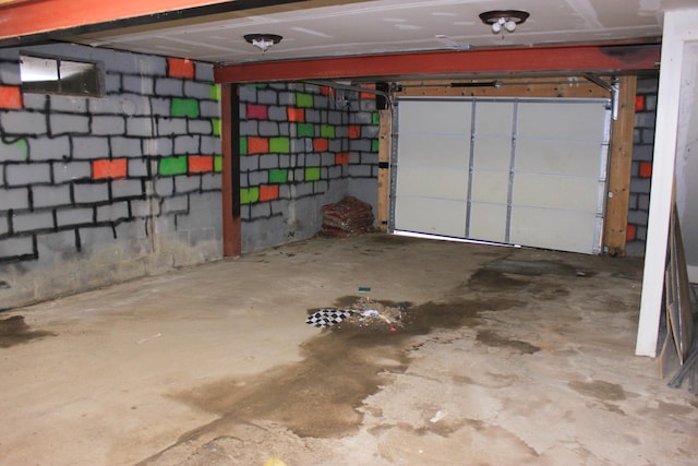 garage featuring concrete block wall