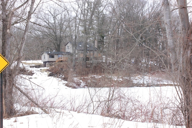 view of yard layered in snow