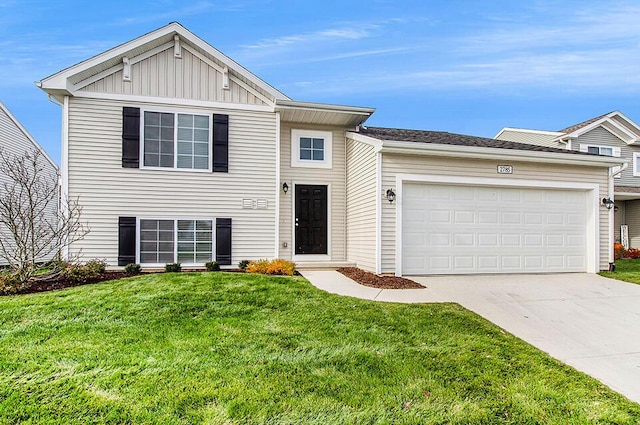 view of front of home with driveway, a front lawn, board and batten siding, and an attached garage