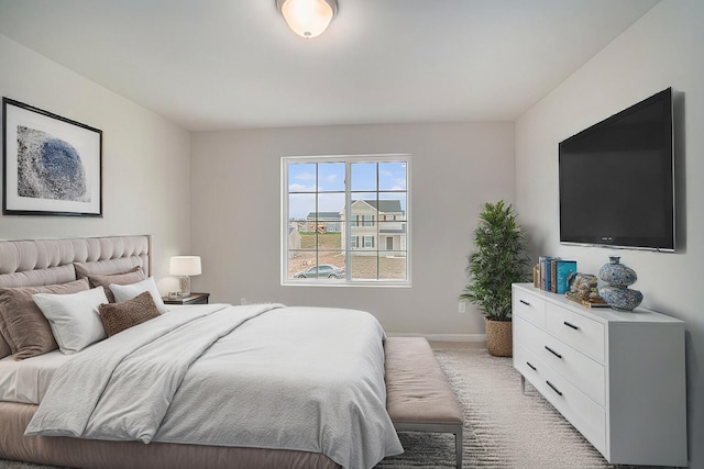 bedroom featuring baseboards and carpet flooring