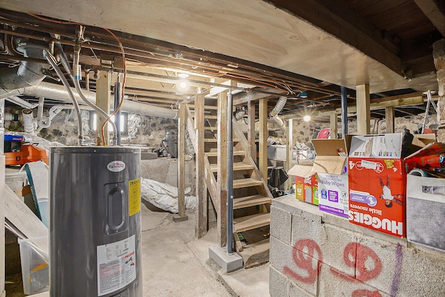 unfinished below grade area featuring electric water heater