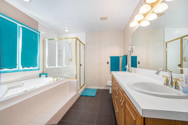 full bath featuring tile patterned flooring, a sink, and a shower stall