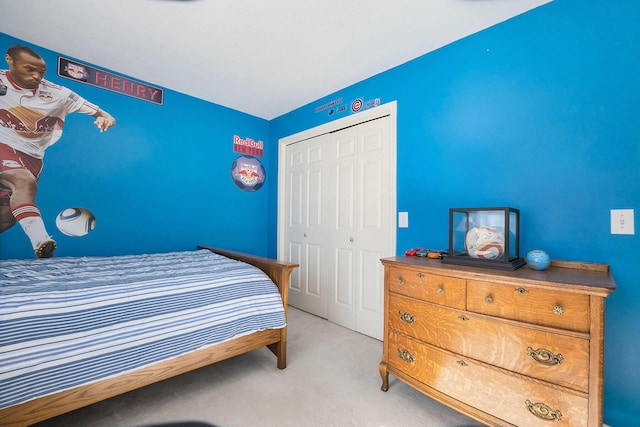 bedroom featuring a closet and light carpet