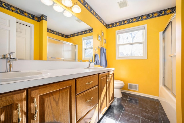 full bathroom featuring an enclosed shower, a sink, and visible vents