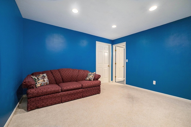 living area with baseboards, carpet, and recessed lighting