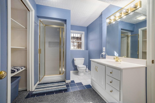 full bathroom featuring a shower with door, vanity, toilet, and tile patterned floors