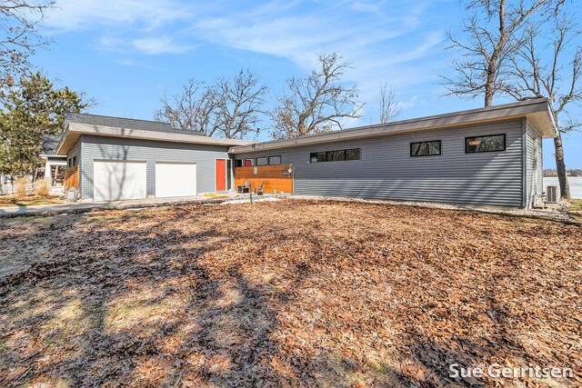view of front of house with a garage and aphalt driveway