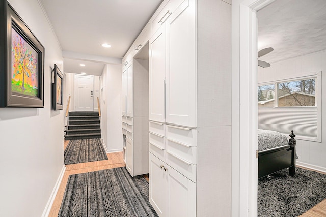 hallway with recessed lighting, dark wood-type flooring, and baseboards