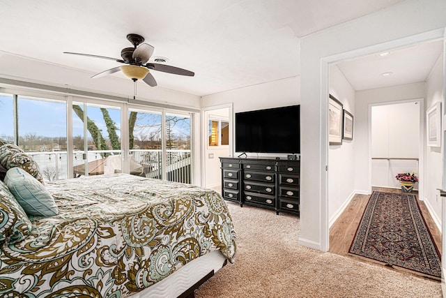 bedroom featuring ceiling fan, baseboards, access to exterior, and carpet flooring