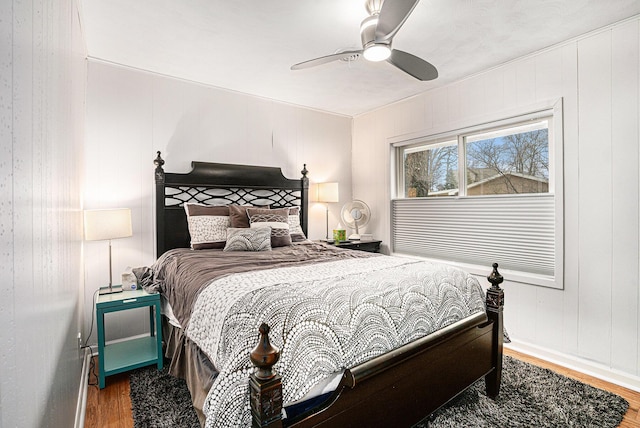 bedroom featuring a ceiling fan and wood finished floors