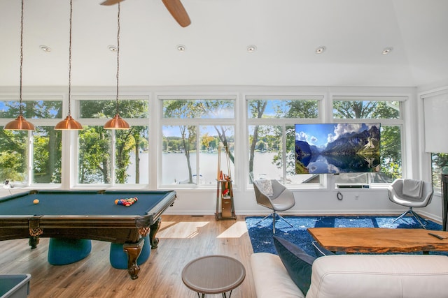 recreation room with a wealth of natural light, billiards, a ceiling fan, and wood finished floors