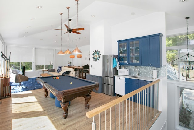 recreation room featuring billiards, light wood finished floors, high vaulted ceiling, a sink, and ceiling fan