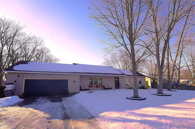 ranch-style home featuring a garage