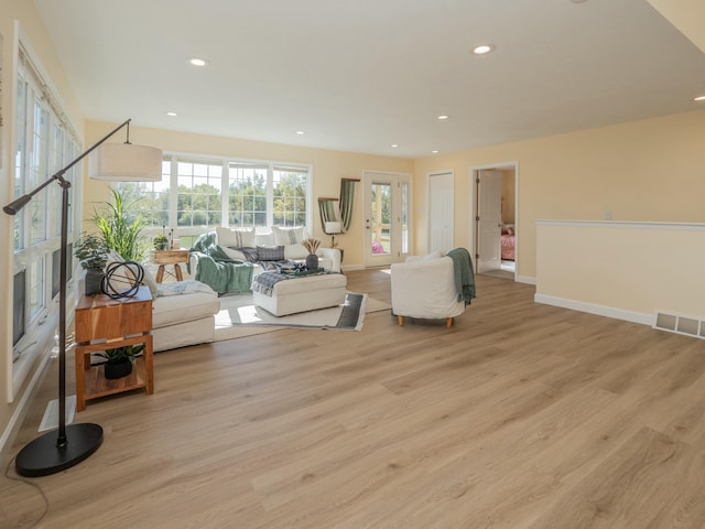 interior space featuring light wood-type flooring, baseboards, visible vents, and recessed lighting