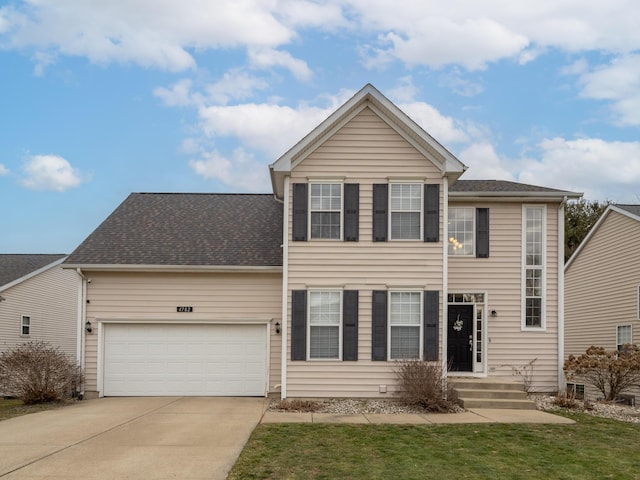 traditional-style home featuring a shingled roof, a front yard, concrete driveway, and an attached garage