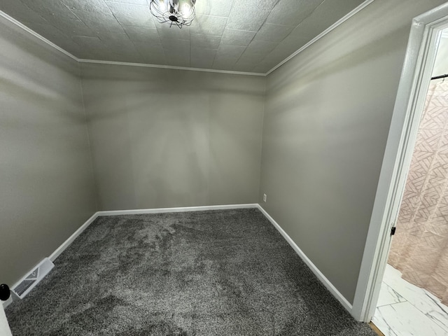 interior space with baseboards, visible vents, and crown molding