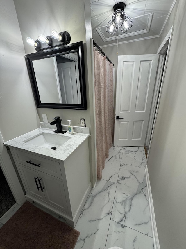 full bathroom with marble finish floor, ornamental molding, vanity, and baseboards