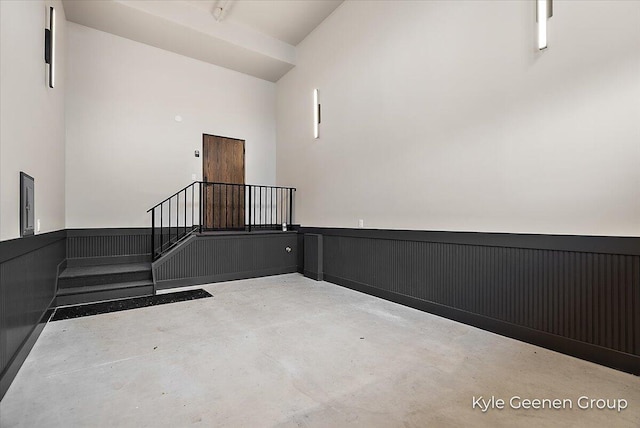 52 E 8th St Ste 210, Holland, MI 49423 - spare room featuring concrete flooring and a wainscoted wall