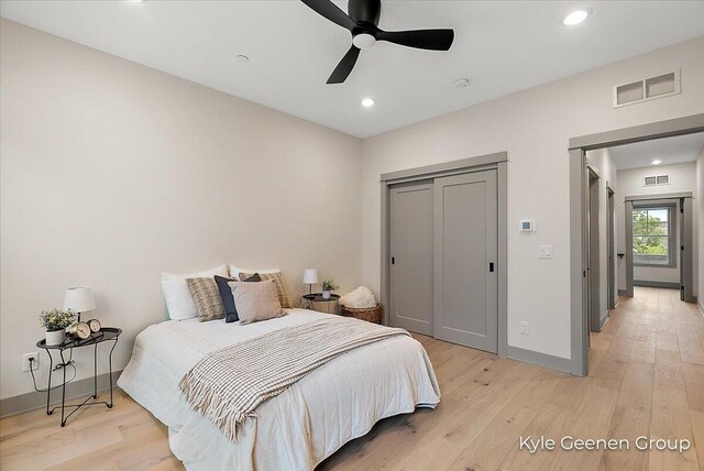 52 E 8th St Ste 210, Holland, MI 49423 - bedroom featuring light wood finished floors, recessed lighting, baseboards, a closet, and a ceiling fan