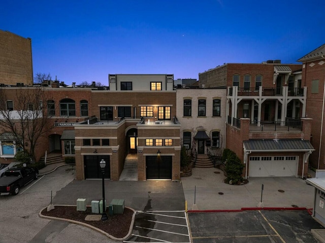 view of front of house featuring a balcony